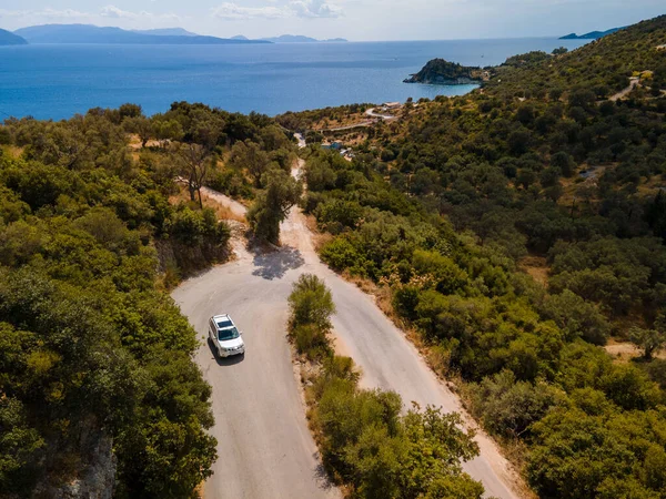 aerial view of car moving by road at Lefkada island Greece near ionian sea