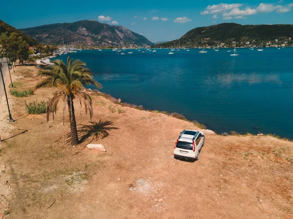 overhead view of the car at sea beach with beautiful view of sea harbor Lefkada island Greece