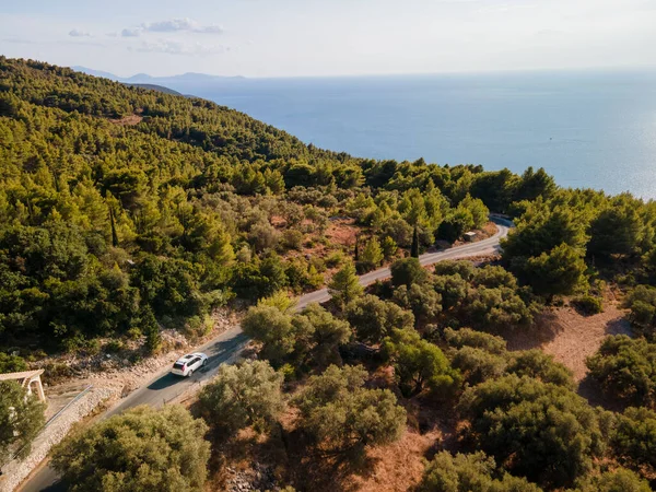 aerial view of car moving by road at Lefkada island Greece near ionian sea