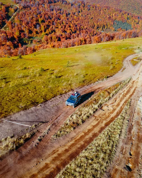 aerial view of off road attraction road to the top of carpathian mountains copy space autumn season