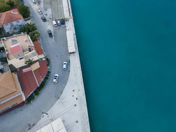 overhead view car moving by road near sea Vasiliki town Greece