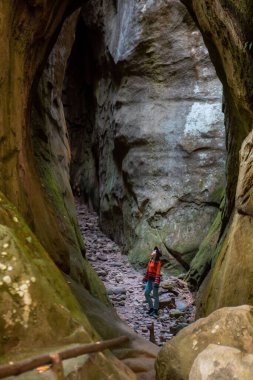 woman traveler walking by trail in canyon copy space
