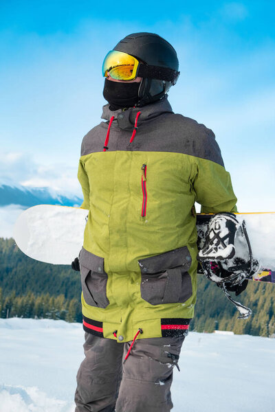 man snowboarder portrait carpathian mountains on background winter sport