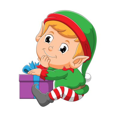 Mutlu yüzlü elf çocuk hediye kutusunun yanında oturuyor.