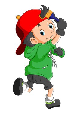 Havalı çocuk resimlerin fırça boyasını tutuyor.