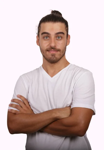 Young man in white T-shirt with white background making funny gestures — Fotografia de Stock