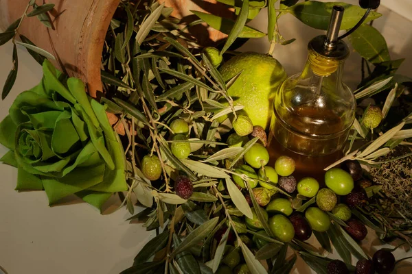 still life of olives and olives on a white table, product photography