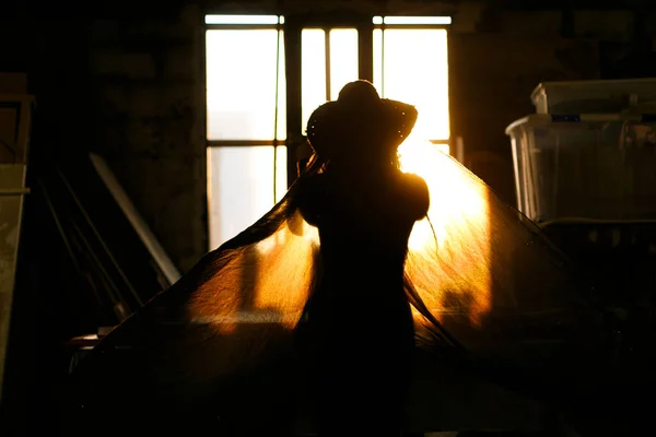 Woman Backlit Window Old Industrial Building Playing Fabrics 스톡 사진