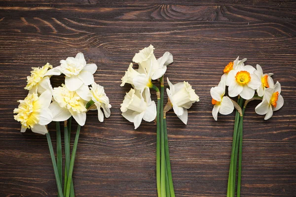 Daffodil Flowers Blue Wooden Background Close Top View — стоковое фото