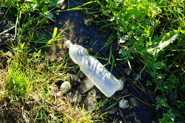 Garbage Concept Environmental Pollution Plastic Bottle Spring Water Top View — Stockfoto