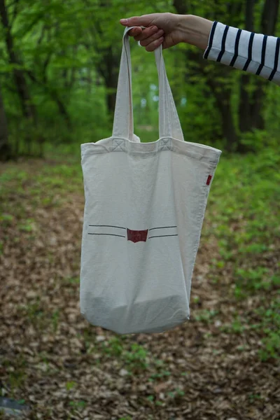 Shopper bag. Eco bag made of double thread. The concept of recycling in the field of environmental protection.