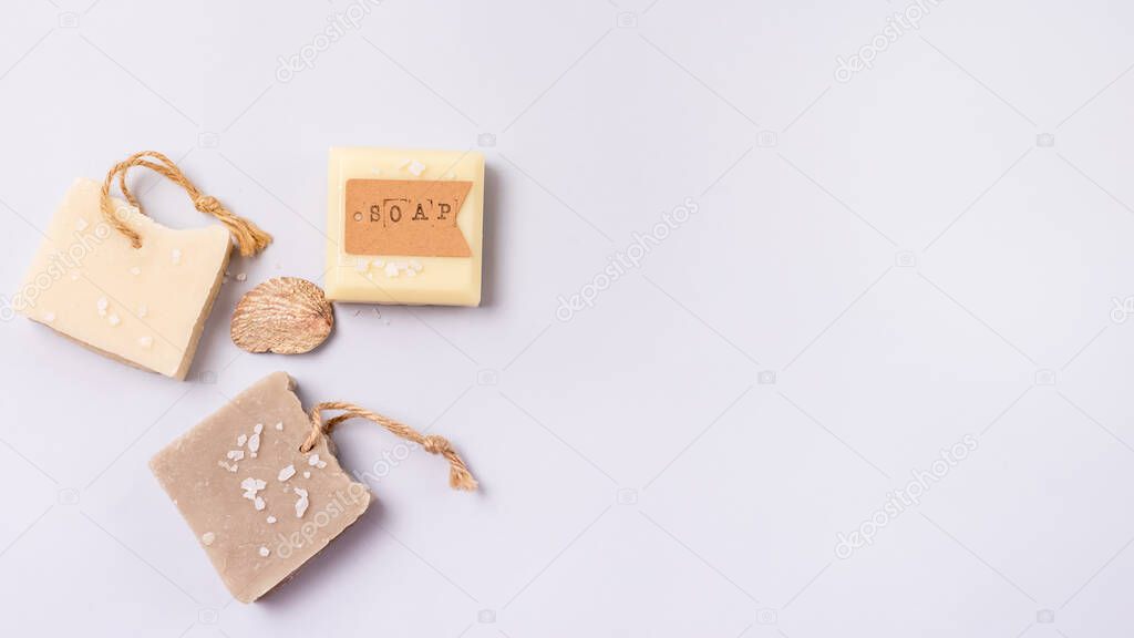 Variety of Natural Soaps on Blue Background Handmade Organic Soaps Vertical Banner Copy Space