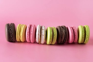 Sweet Colorful Macarons on Pink Background Tasty Colourful Macaroons French Dessert Horizontal