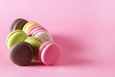 Sweet Colorful Macarons on Pink Background Tasty Colourful Macaroons French Dessert Copy Space