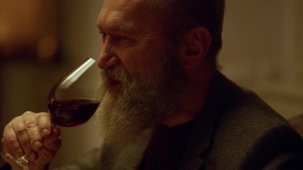 Closeup smiling senior man drinking red wine glass. Grandfather celebrating — Stock Video