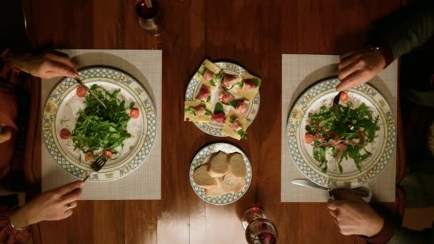 Senior couple eating delicious meals in restaurant. Top view family dinner — Stock Video