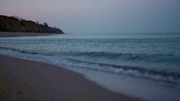 Peaceful morning sandy beach seascape at cold evening sunset. Blue sea water — Stock Photo, Image