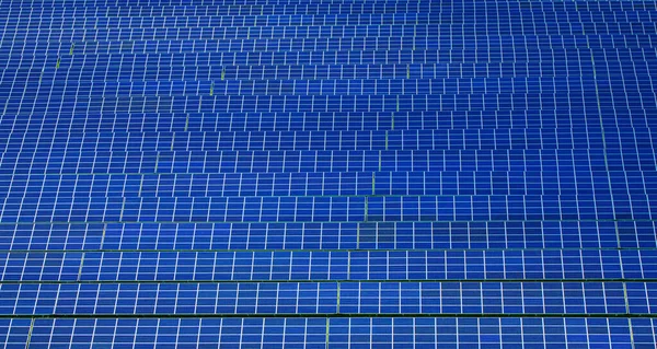 Blue solar panels rows. Alternative energy source. Top view solar panels park — Stock Photo, Image