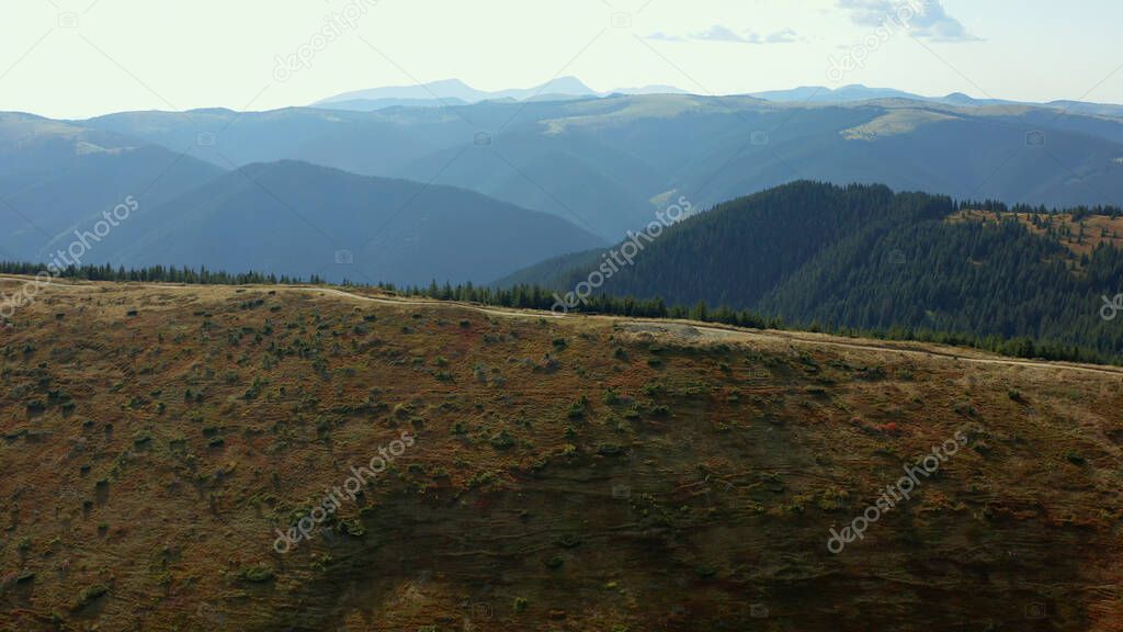 Aerial beautiful hills road way for travellers stunning rocky mountains panorama