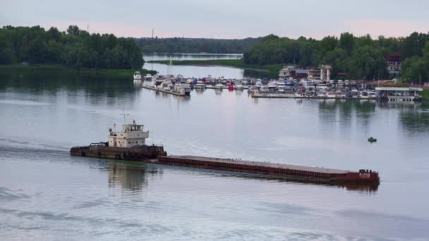 Tug boat pushing barge at mooring view drone shot. Empty cargo ship floating. — Stock Video