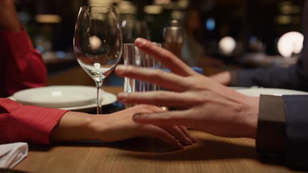 Romantic couple holding hands in luxury interior restaurant. Dating concept. — Stock Video