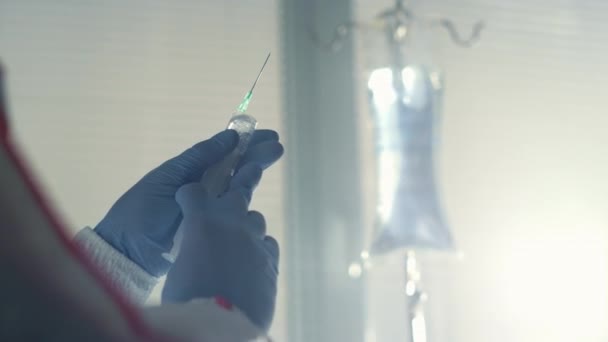 Nurse holding syringe vaccine close up. Hospital infectious disease department — Stock Video