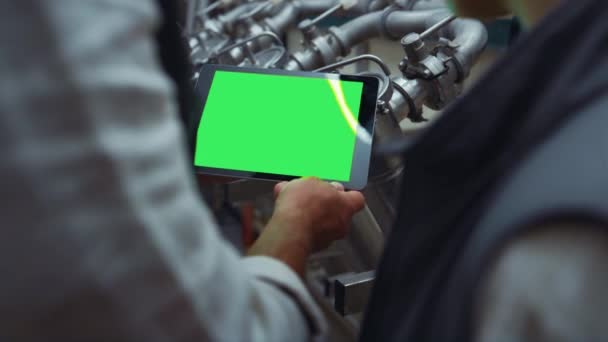 Engineer hands swiping tablet with chroma key screen at steal equipment closeup — Stock Video