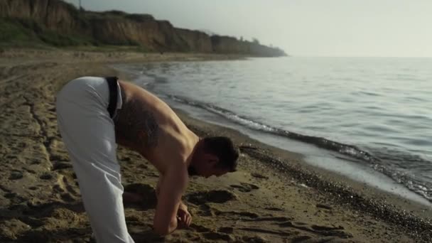 Attractive Tattooed Man Bending Ground Stretching Beach Strong Sportsman Training — стоковое видео