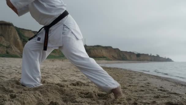 Man legs stepping making karate exercise close up. Man training combat skills. — Wideo stockowe