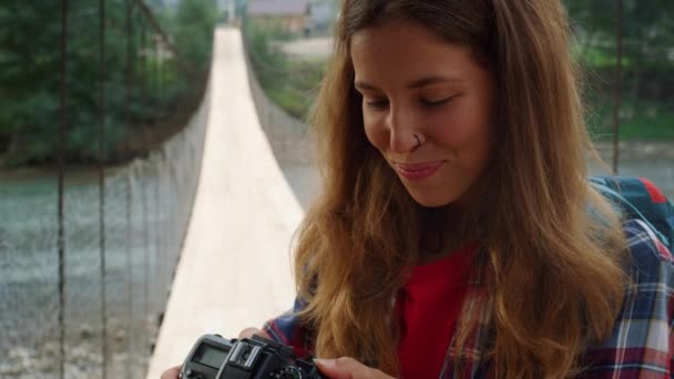 Smiling girl enjoy photographing beautiful nature . Woman check camera pictures. — Video Stock
