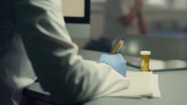 Woman therapist making medical journal entries at hospital workplace close up. — Αρχείο Βίντεο