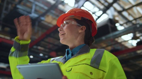 Joyful woman supervisor smiling at huge digital modern production warehouse. — ストック写真