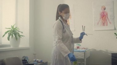 Woman medic taking saliva sample old patient. Doctor testing senior man on covid