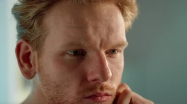 Closeup thoughtful man watching game. Tensed sport fan worry online results