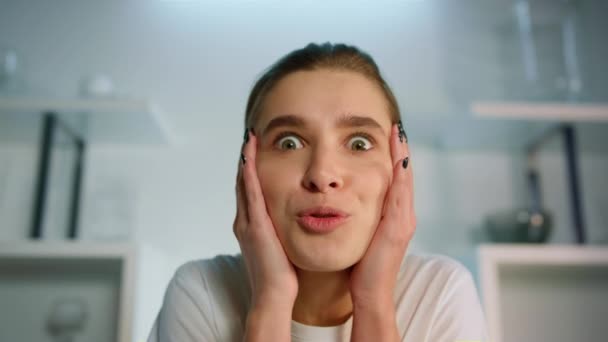 Closeup emotional girl videocalling sharing exciting news. Web camera view. — Vídeos de Stock