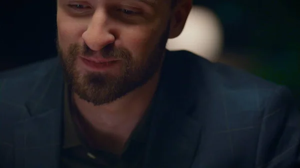 Joyful man eating dinner in luxury restaurant. Handsome gentleman enjoying salad food meal at fine dining place. Businessman sitting on romantic date in loft interior cafe. Healthy nutrition concept.