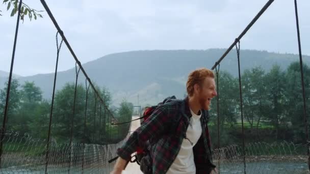 Emotional Tourist Celebrate Turn River Bridge Happy Hiker Jump Mountains — Stockvideo