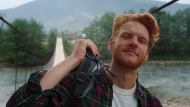 Smiling Hiker Posing Camera River Bridge Portrait Happy Traveler Wear — Vídeos de Stock