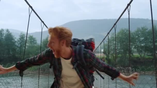 Euphoric Hiker Jump Outdoors River Bridge Close Joyful Backpacker Feel — Stockvideo