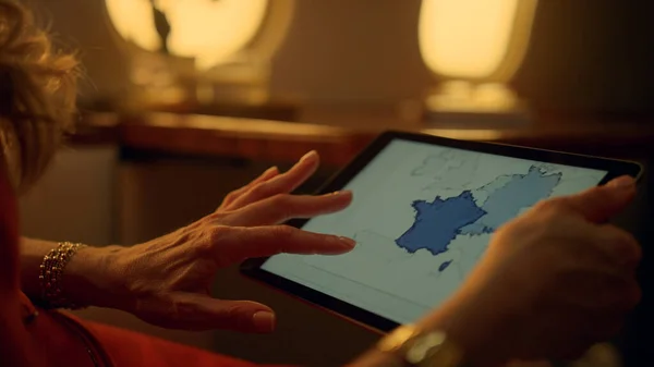 Closeup hands touching tablet computer screen. Business lady working on aircraft. Unrecognized financial expert ceo travel checking sales statistics. First class passenger analyze data on digital pad