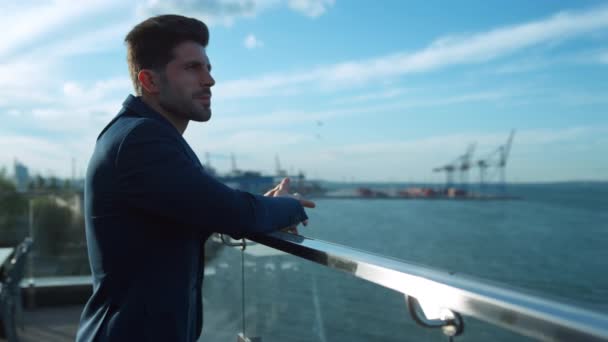 Confident Businessman Rest Balcony Morning Sunlight Sea Port Cranes View — Stock videók