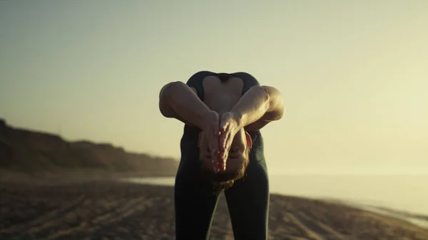 Attractive Girl Pulling Arms Back Practicing Bridge Pose Sunset Close — Zdjęcie stockowe