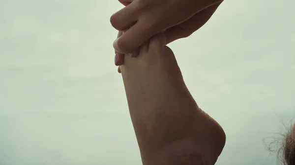 Close Girl Bare Feet Stretching Hands Grey Sky Sea Beach — стоковое фото