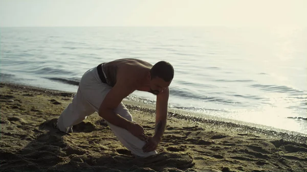 Muscular Man Stretching Body Sandy Beach Evening Time Karate Fighter — Photo