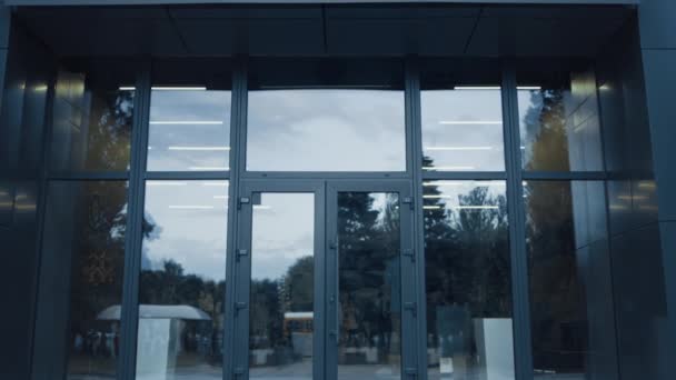 Elementary School Exterior Closed Glass Door View Window Reflecting Sky — Video