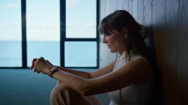 Sad businesswoman leaning wall considering life marriage problems close up. Stressed brunette ceo office worker failing project get fired. Depressed professional thinking financial solution feel upset