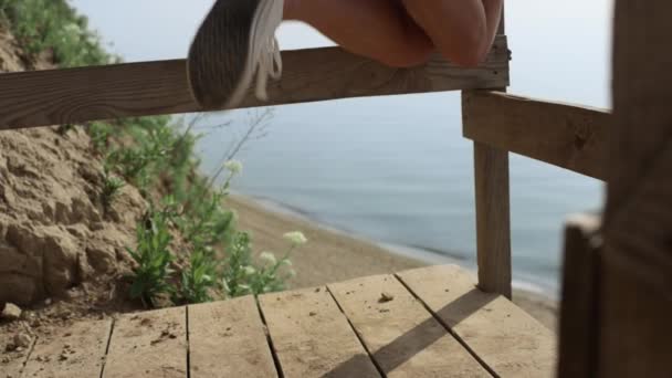 Unkwown Girl Legs Having Fun Wearing White Sneakers Wooden Seashore — 图库视频影像