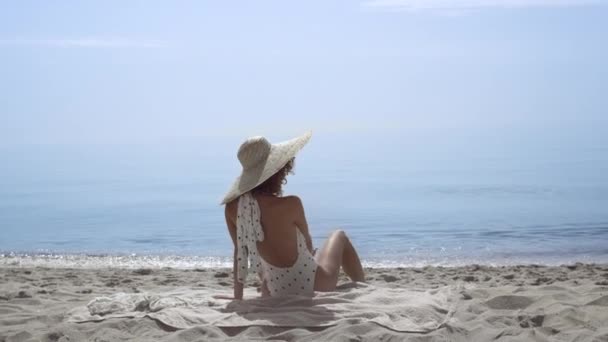 Tempting Slim Woman Sitting Beach Wearing Polka Dots Swimsuit Front — Vídeo de Stock