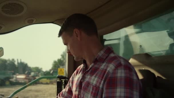 Tractor Driver Cabin Checking Machinery Closeup Focused Farmer Working Grain — Video