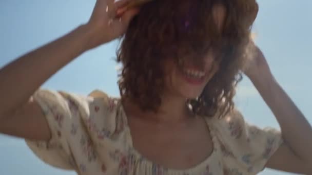 Excited Cheerful Woman Jumping Holding Straw Hat Head Close Young — Vídeo de Stock